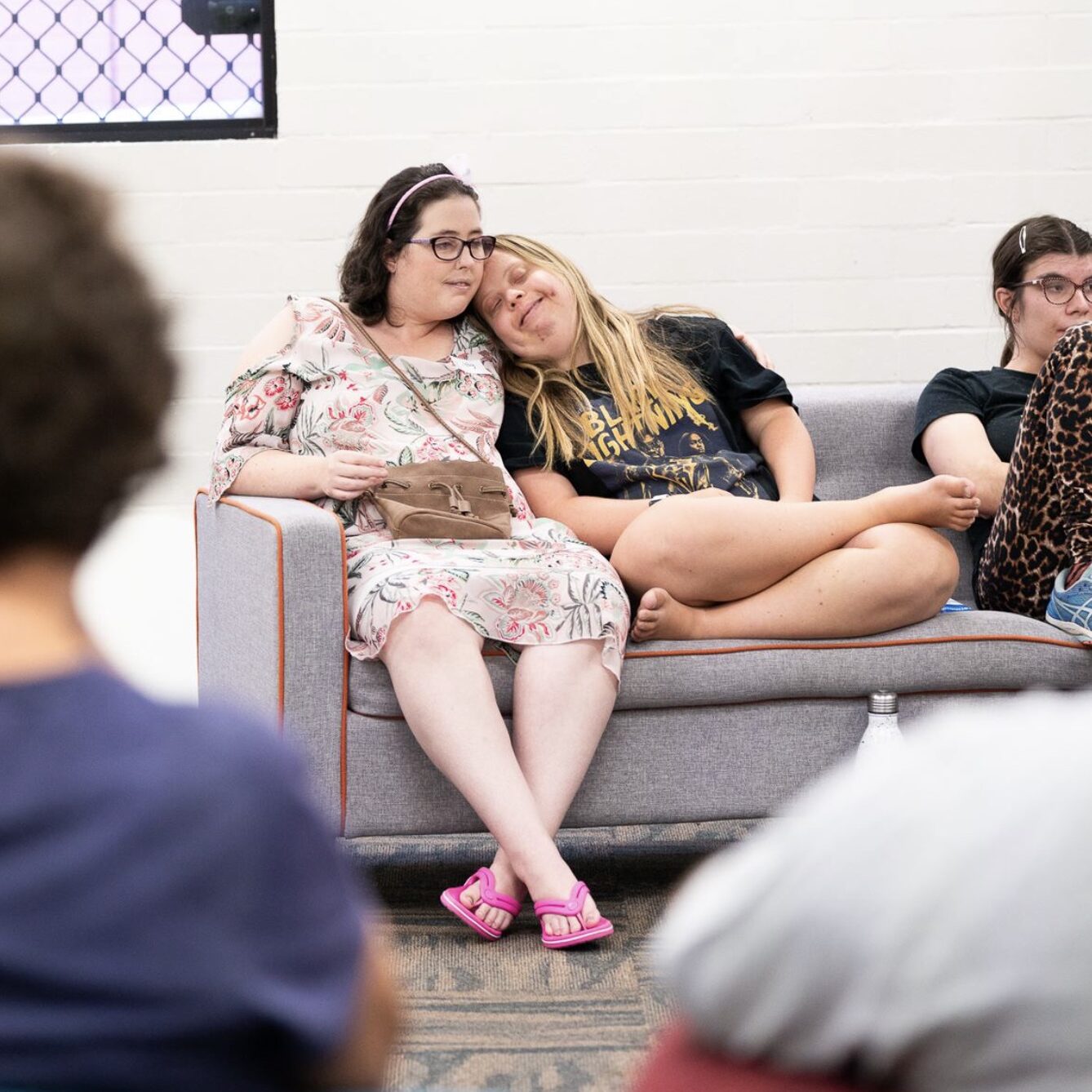 photo of Laurenand Libby sitting together on the couch