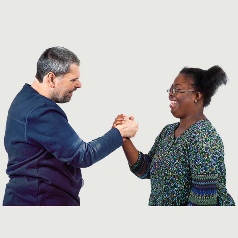 A man and a woman doing a cool handshake