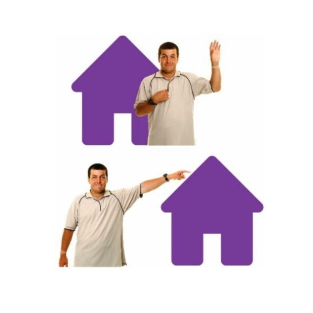 Man standing next to a house