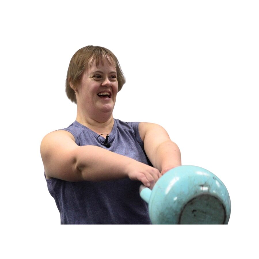 person-at-the-gym-smiling-and-swinging-a-kettle-ball-weight-in-thier-hands