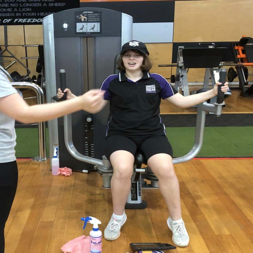 picture of a person exercising at the gym with weights