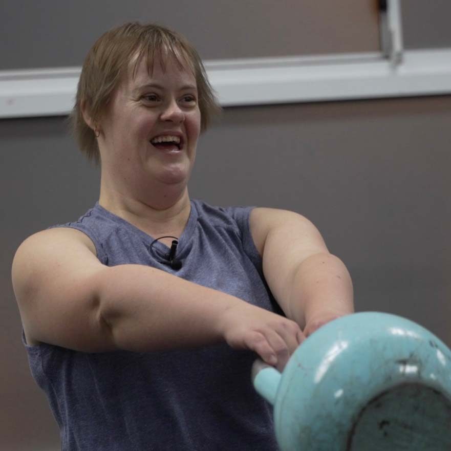 picture of person exercising at the gym with kettle ball